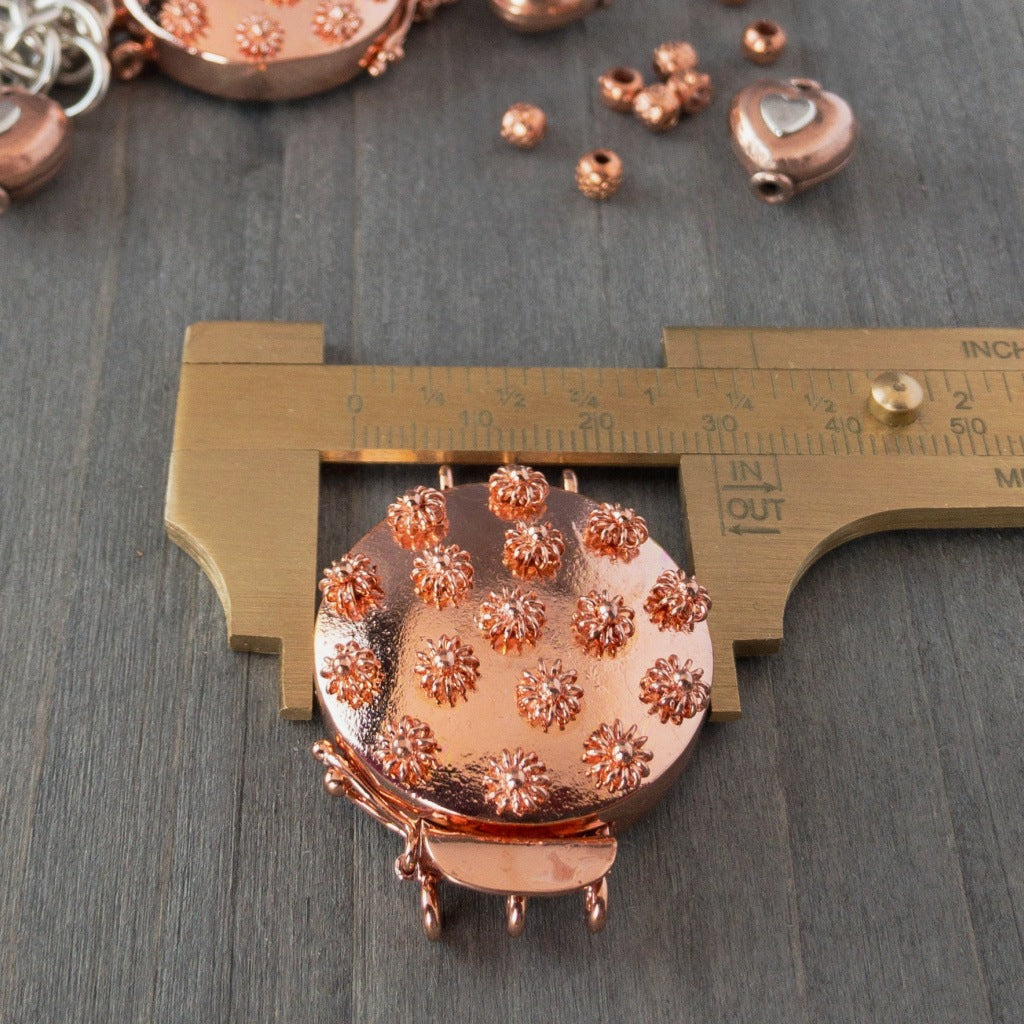 Embellished with adorable 3-D copper flowers, this triple strand, copper box clasp was individually handcrafted in 100% pure copper, exclusively for Suzie Q Studio.