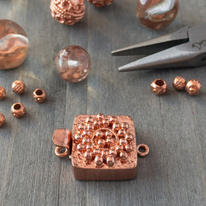 Small round balls of copper are used in this clasp design to create a mandala-style pattern, which is very textural and versatile enough to suit a wide variety of jewellery creations. This copper box clasp was individually handcrafted in 100% pure copper, exclusively for Suzie Q Studio.