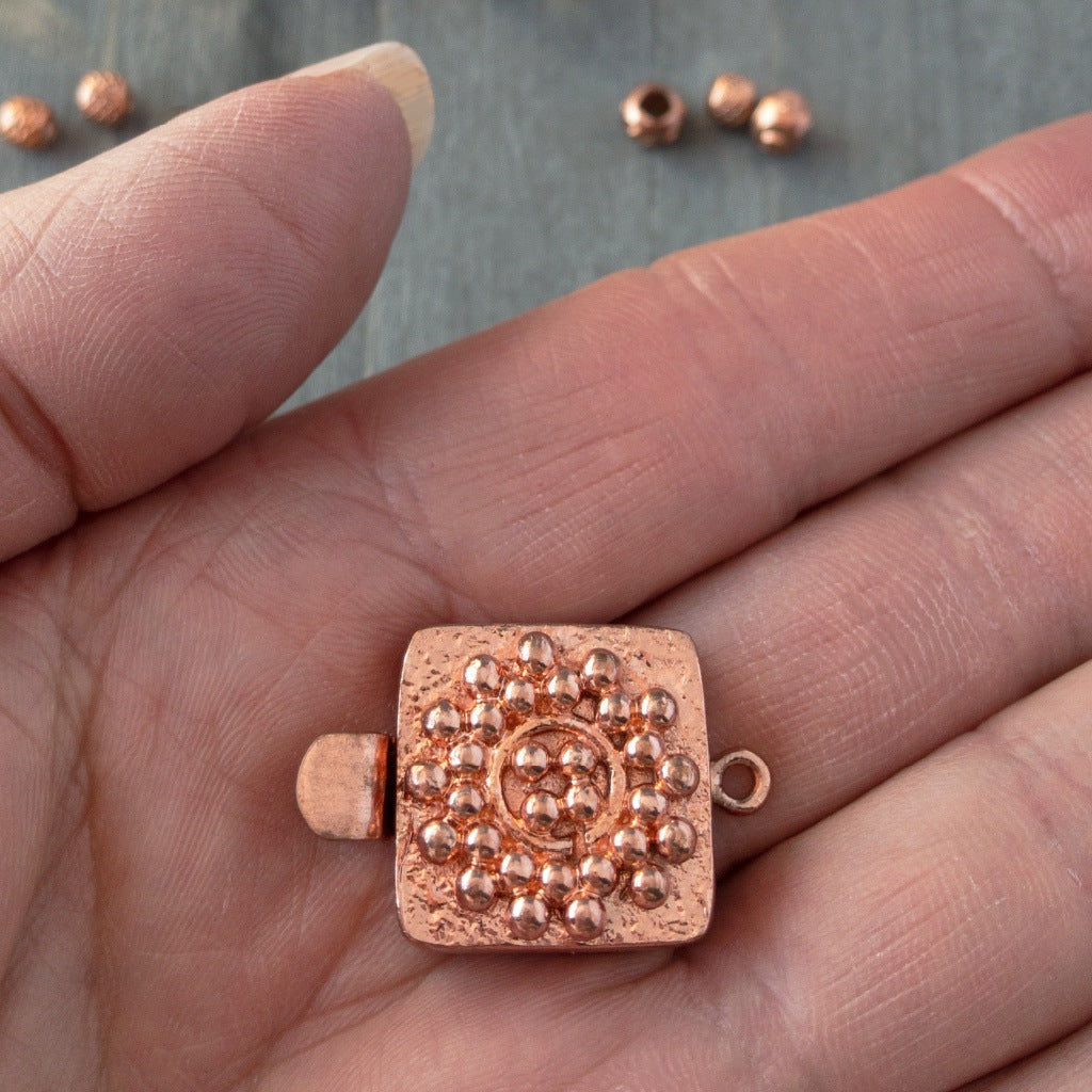 Small round balls of copper are used in this clasp design to create a mandala-style pattern, which is very textural and versatile enough to suit a wide variety of jewellery creations. This copper box clasp was individually handcrafted in 100% pure copper, exclusively for Suzie Q Studio.
