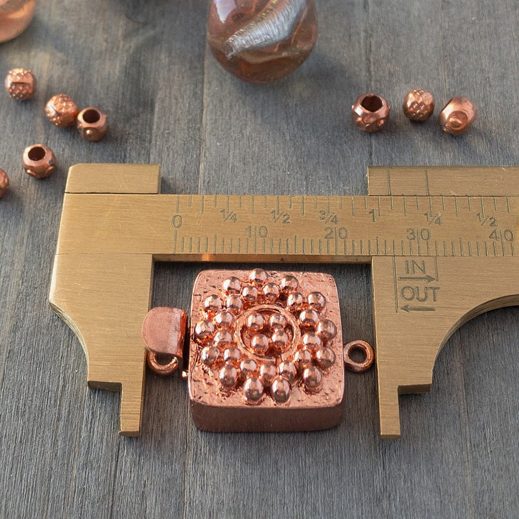 Small round balls of copper are used in this clasp design to create a mandala-style pattern, which is very textural and versatile enough to suit a wide variety of jewellery creations. This copper box clasp was individually handcrafted in 100% pure copper, exclusively for Suzie Q Studio.