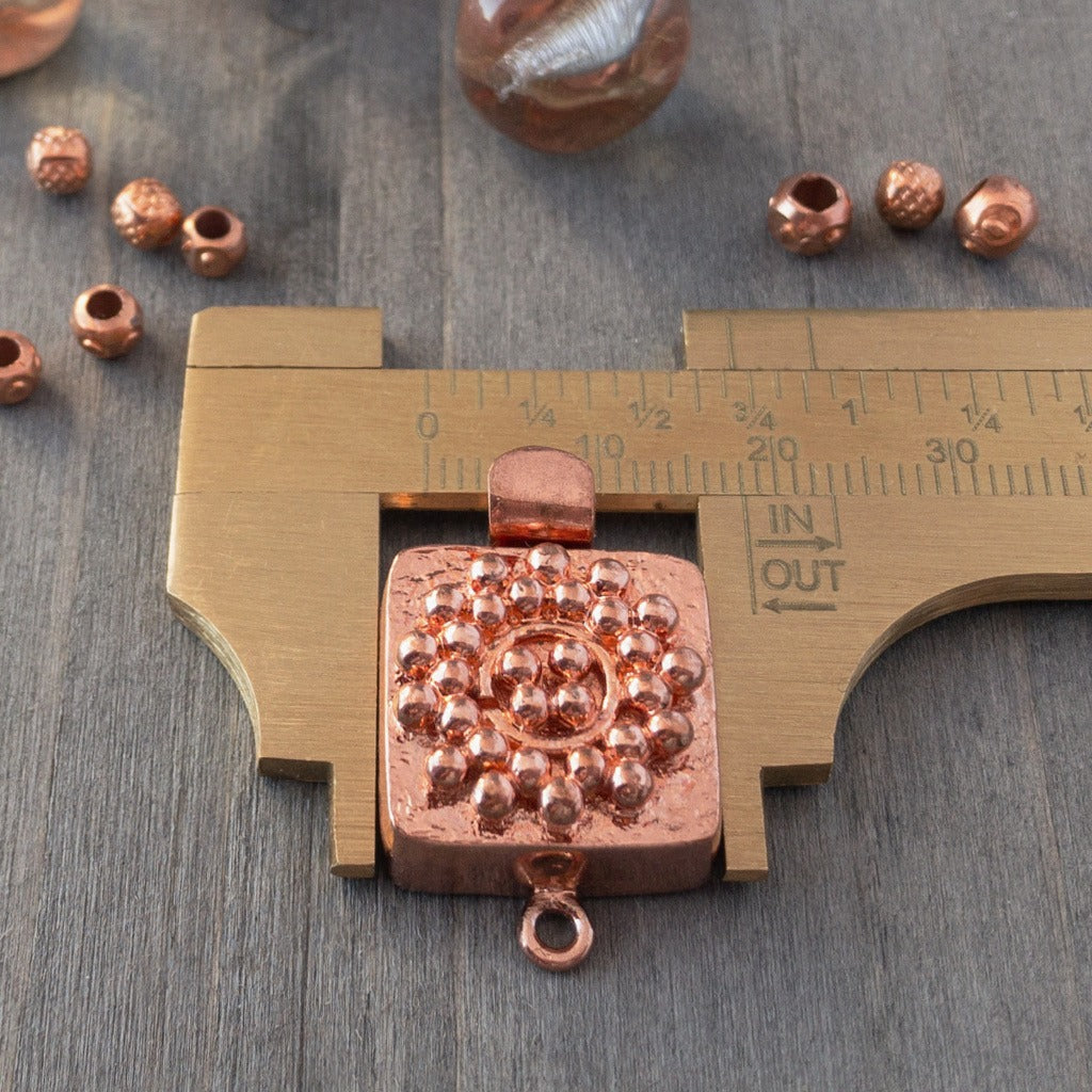 Small round balls of copper are used in this clasp design to create a mandala-style pattern, which is very textural and versatile enough to suit a wide variety of jewellery creations. This copper box clasp was individually handcrafted in 100% pure copper, exclusively for Suzie Q Studio.