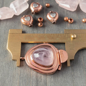 Showcasing a triangle-shaped vintage glass cabochon, in a lovely tone of "hint-of-pink" colour, this custom box clasp was individually handcrafted in 100% pure copper, exclusively for Suzie Q Studio.