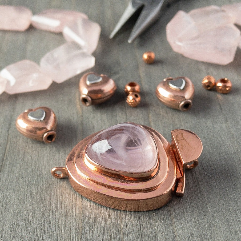 Showcasing a triangle-shaped vintage glass cabochon, in a lovely tone of "hint-of-pink" colour, this custom box clasp was individually handcrafted in 100% pure copper, exclusively for Suzie Q Studio.