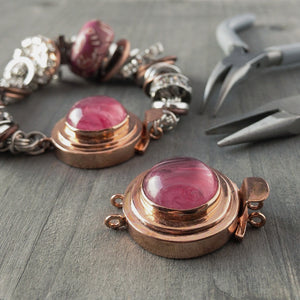 This unique, double strand, custom box clasp was individually handcrafted in 100% pure copper and features a pink-coloured, vintage glass cabochon for you to create a one-of-a-kind piece of extra-ordinary jewellery.