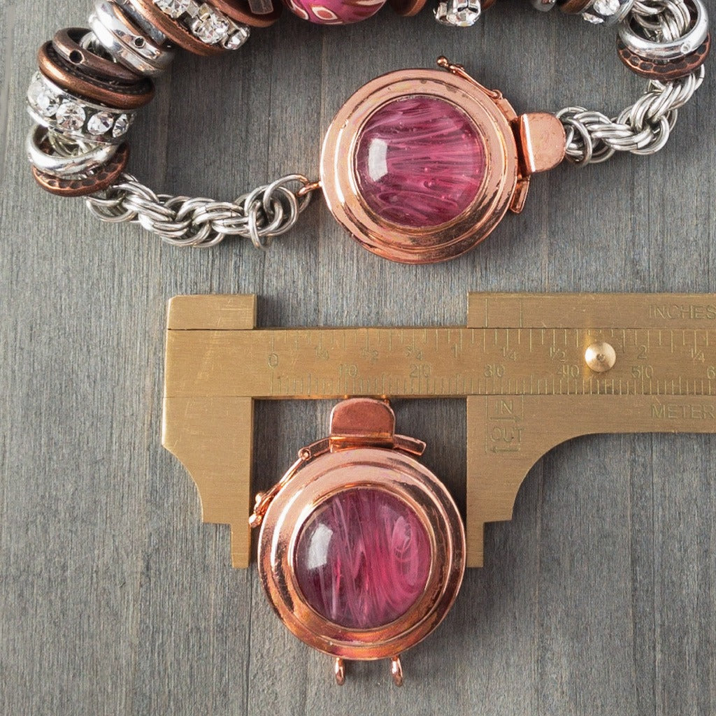 This unique, double strand, custom box clasp was individually handcrafted in 100% pure copper and features a pink-coloured, vintage glass cabochon for you to create a one-of-a-kind piece of extra-ordinary jewellery.