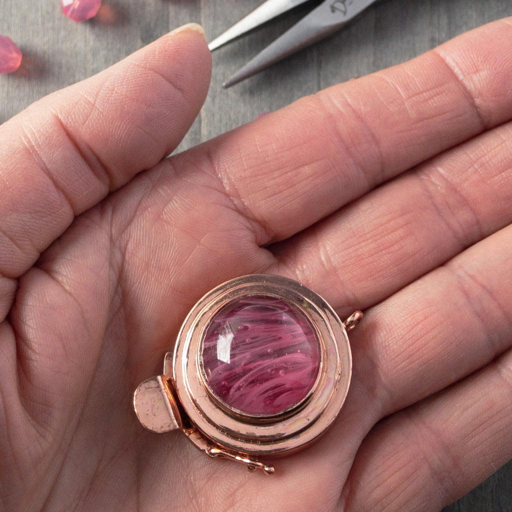 This unique, single strand, custom box clasp was individually handcrafted in 100% pure copper and features a lovely pink-coloured, vintage glass cabochon for you to create a one-of-a-kind piece of extra-ordinary jewellery.