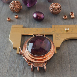 This unique box clasp showcases a warm, amethyst-coloured, vintage, faceted glass cabochon, and is surrounded by copper that has a beautiful natural, antique patina finish. It was individually handcrafted in 100% pure copper, exclusively for Suzie Q Studio.