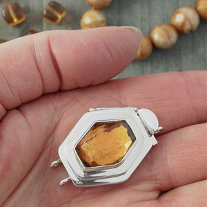 In addition to the uncommon diamond shape of the vintage glass cabochon in this double-strand, sterling silver box clasp, the rich amber colour gives this piece an ultra-luscious look, which would totally lend itself to mixing gold metal with the silver, if you were so inclined.