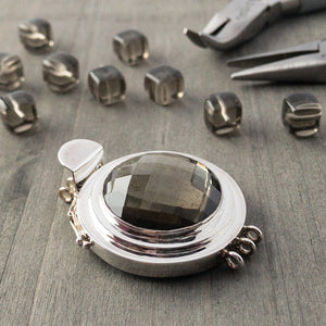 The faceted, black diamond-coloured vintage glass cabochon featured in this triple-strand, sterling silver box clasp is absolutely gorgeous, as well as neutral enough to work with any colours and suit any design style.