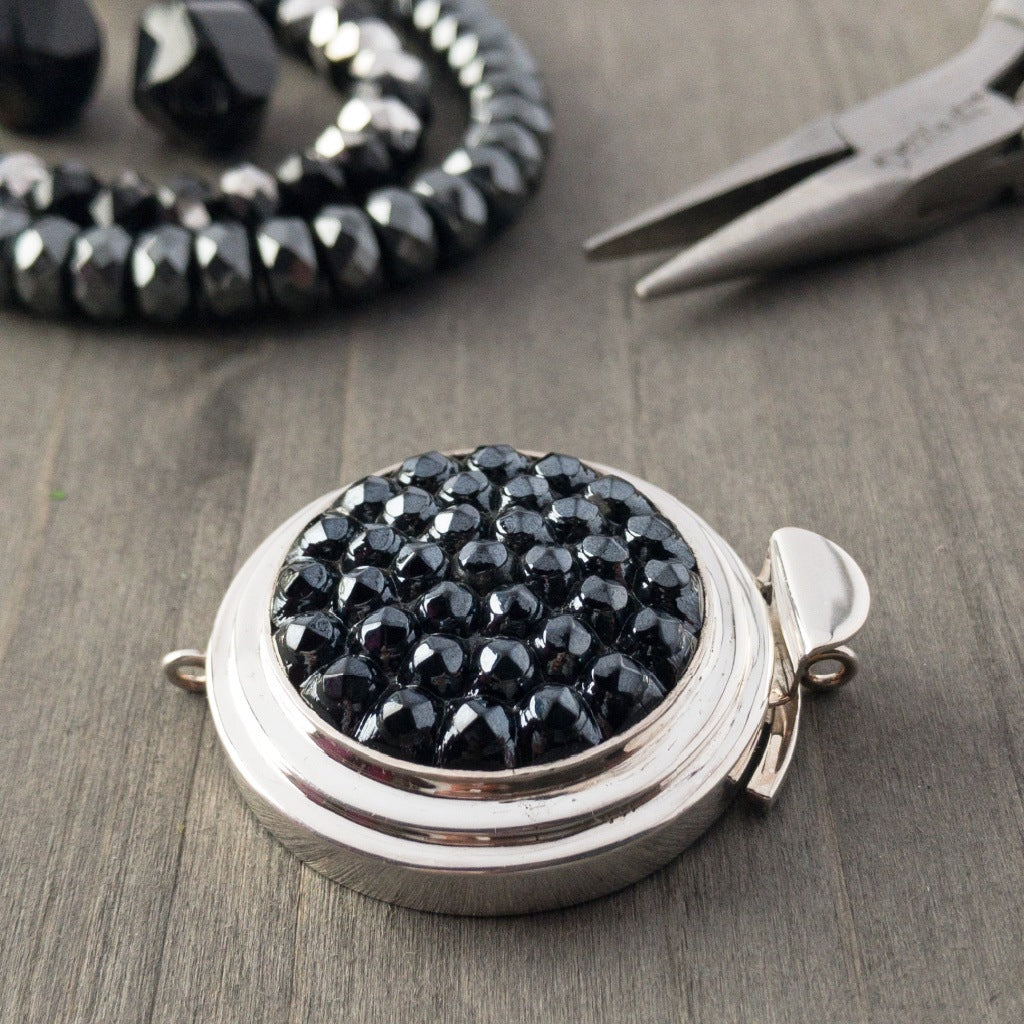 The "extra-texture", hematite-coloured, vintage glass cabochon featured in this sterling silver box clasp is fantastic! It would make a sensational focal piece for either a chunkier chain and/or bead bracelet, or for almost any length of necklace.