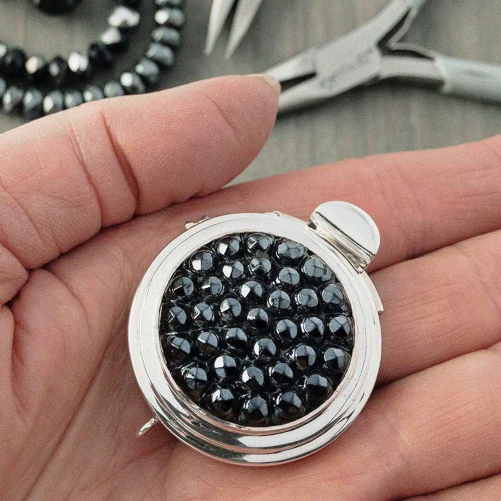 ROUND, HEMATITE-COLOURED, VINTAGE GLASS CABOCHON, STERLING SILVER BOX CLASP
